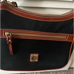 New no tags (never used) Black Dooney and Burke , red lining w/dust bag